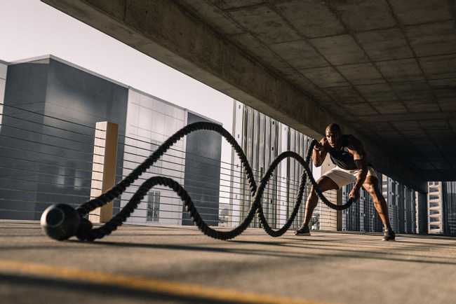 Man pulling ropes